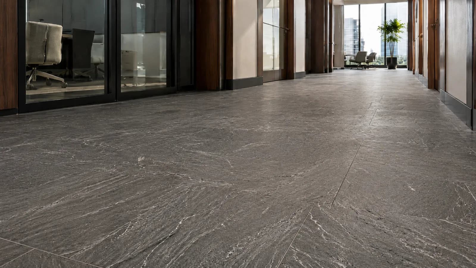 Slate floor in an office lobby with a flat, matte appearance before treatment.