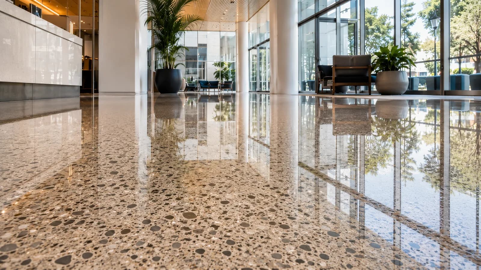 The same terrazzo floor with a deep, reflective polish after Duralyx Crystl Bond™ treatment.