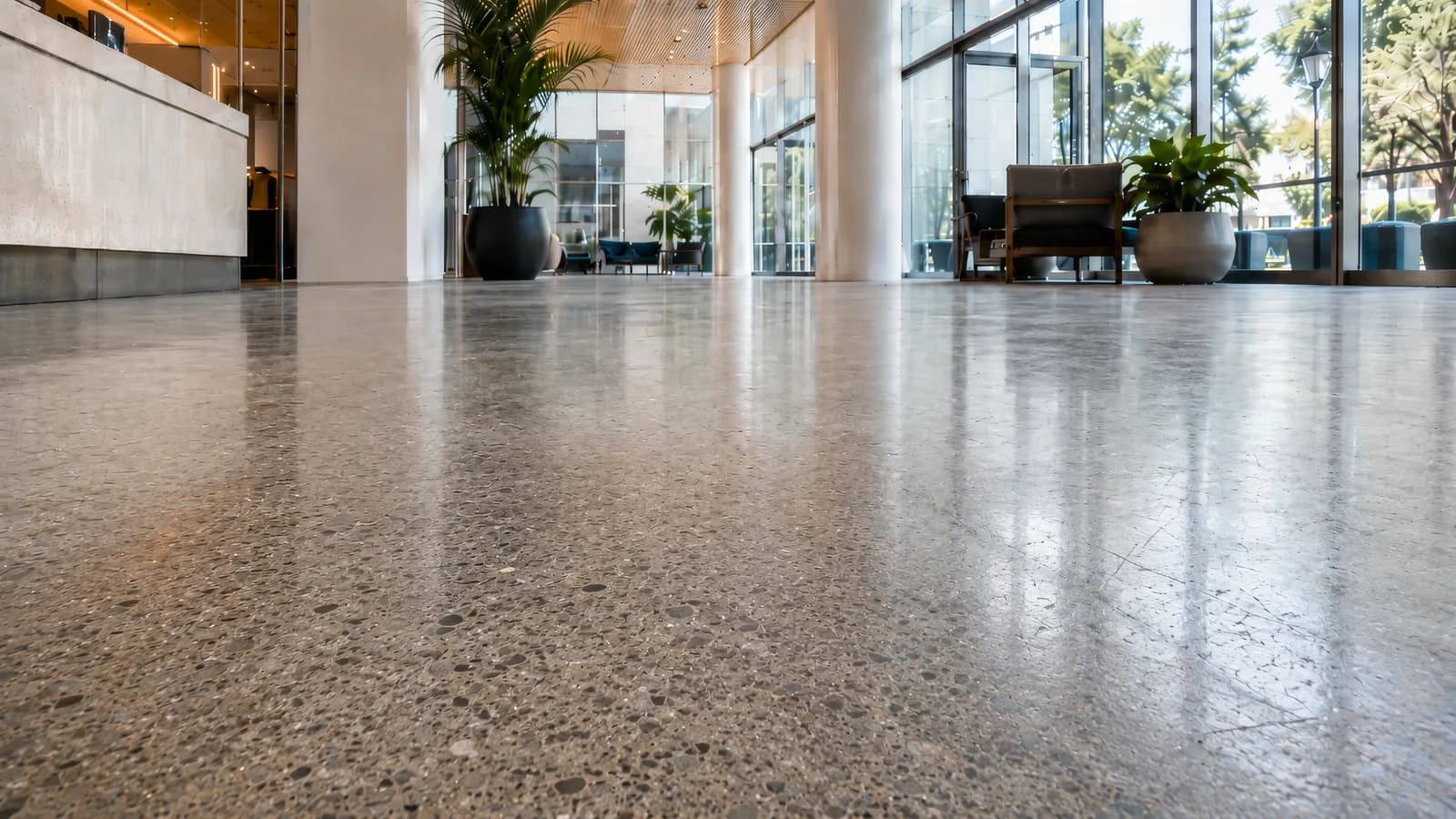 Terrazzo floor with a faded, matte appearance before treatment.