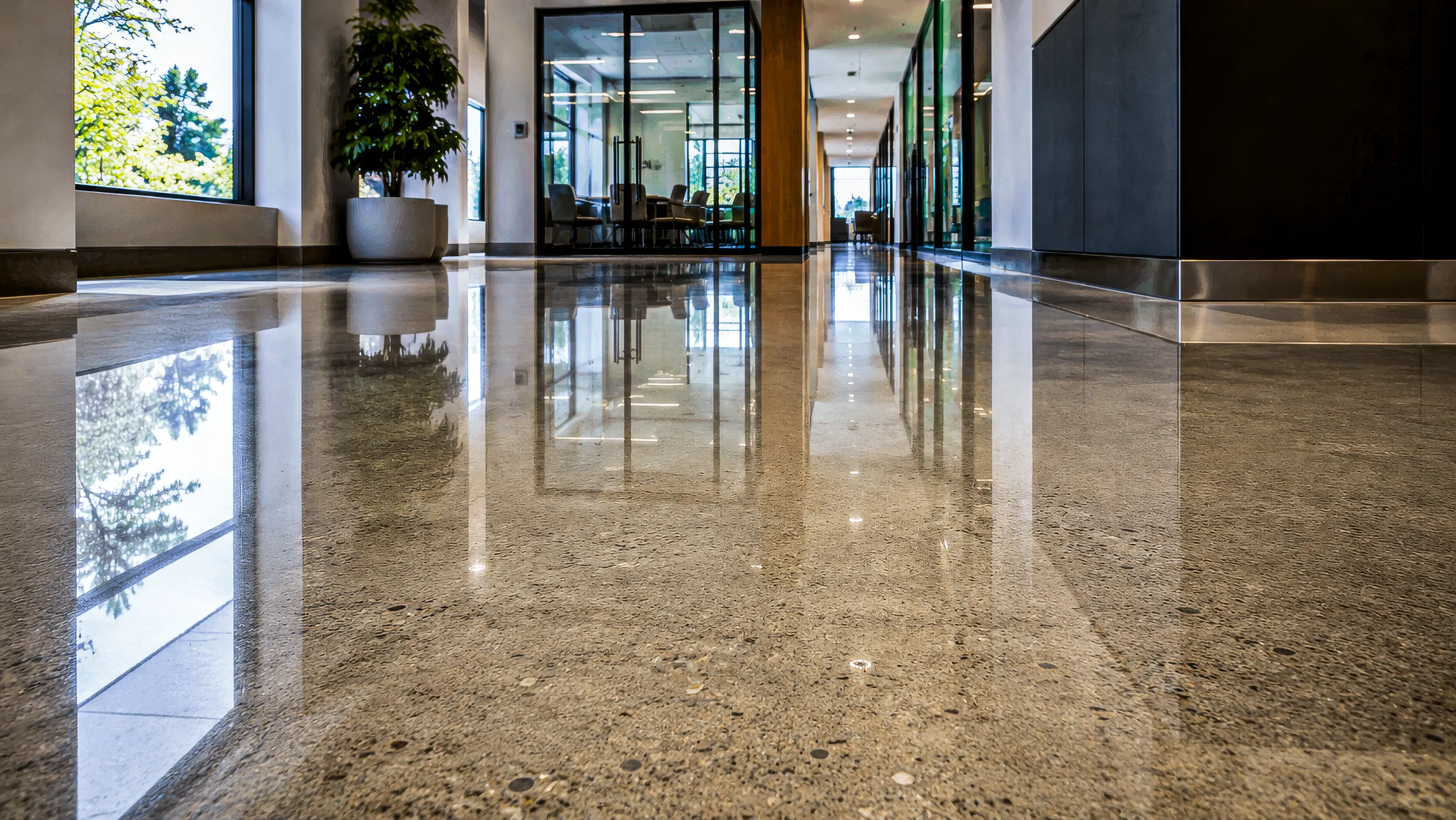 Polished concrete floor in a modern commercial lobby.