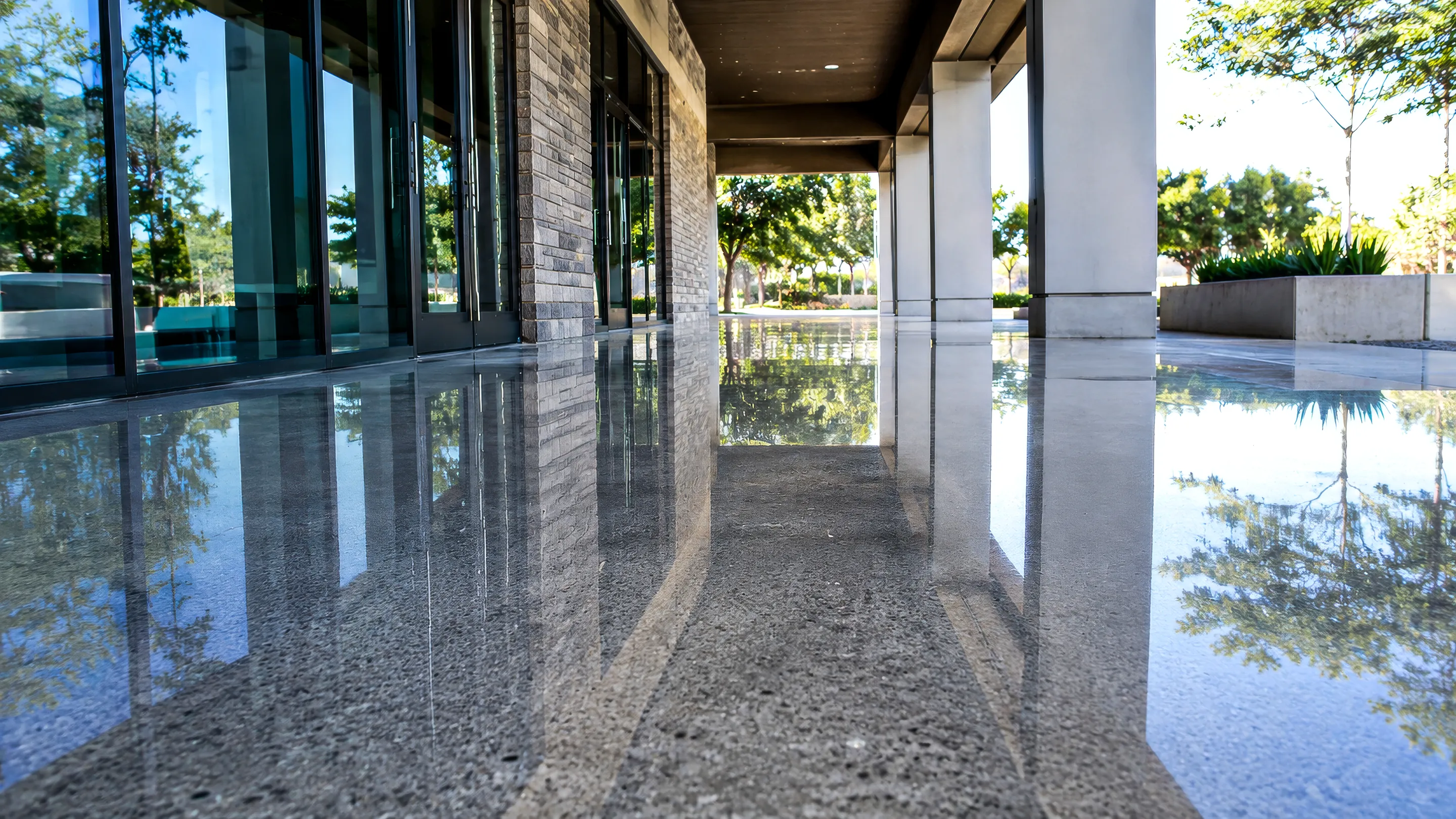 Polished exterior concrete at a modern building entrance.